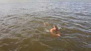 Kobuk Valley - Luke swimming in the cold Arctic water in Kotzebue
